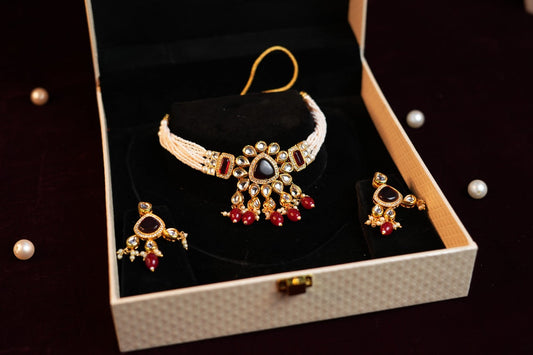 Red Stone Off-White Gold Plated Crystal Studded Beaded Layered Choker Set